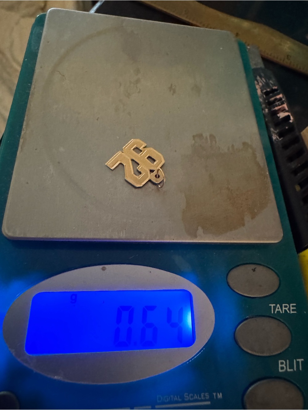 14k real gold stamped acid test .64 grams